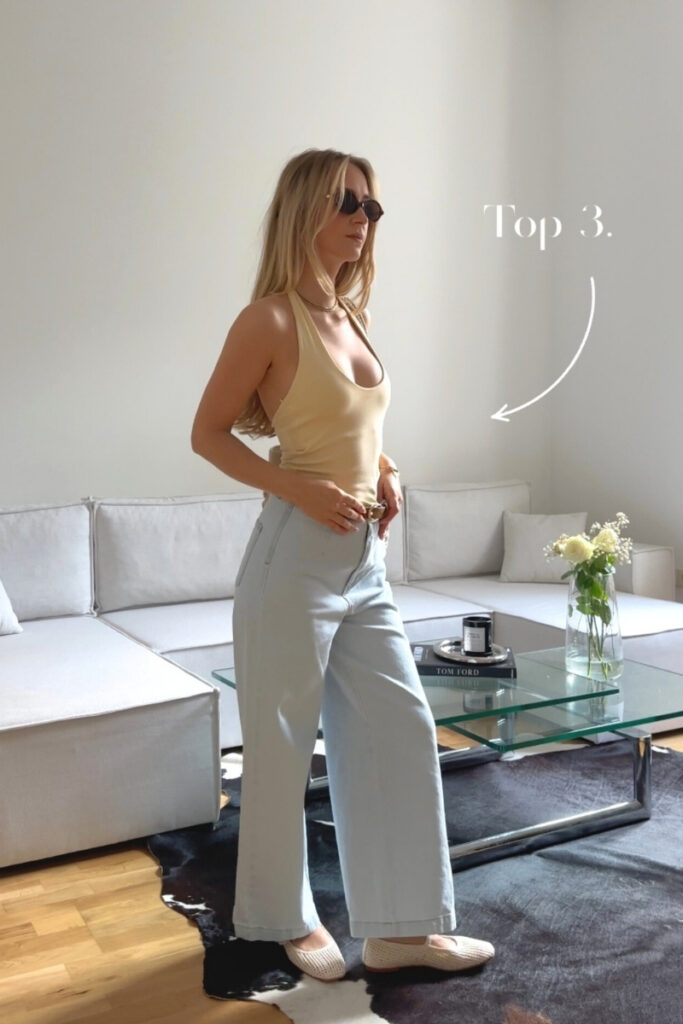 blond girl posing in a living room